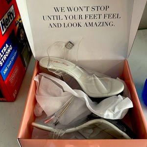 Brand new… never worn! Clear posing high heels.